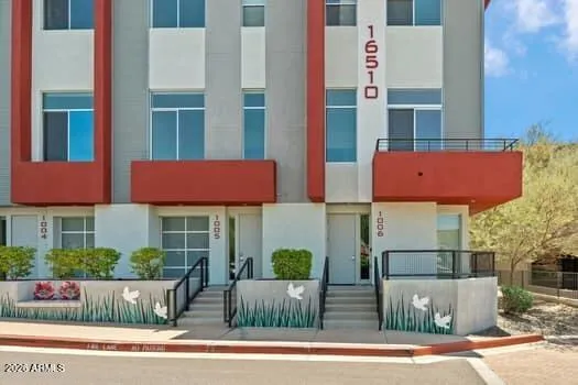 Exterior view showcasing the townhouse entry and contemporary architectural design.