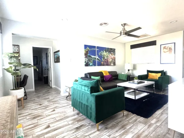Living area with hallway to workspace and laundry room
