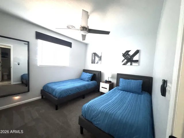 Bedroom 3 with window view to backyard