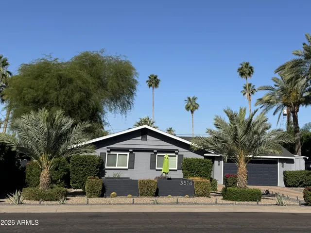 Front of home with oversized 2 car garage with additional storage area