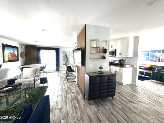 Open floorplan, left to right: Family room/ Kitchen/ Living area