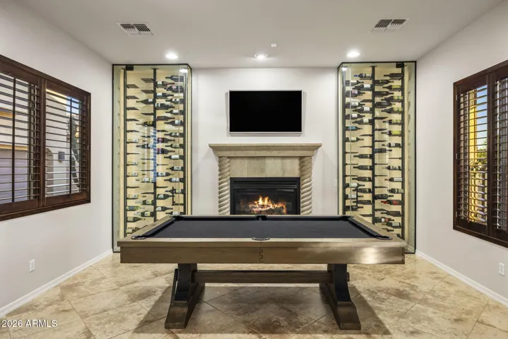 This space is ideal for entertaining friends and family. The custom wine rack lights up and creates a beautiful display.