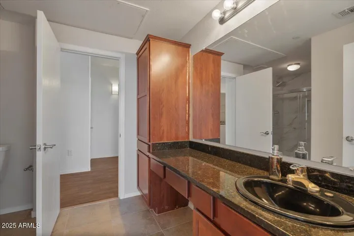 Secondary Bathroom - extended vanity and linen storage