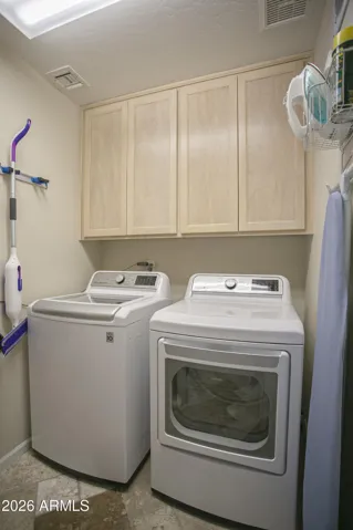 Walk-in laundry with gas dryer and washing machine which both convey