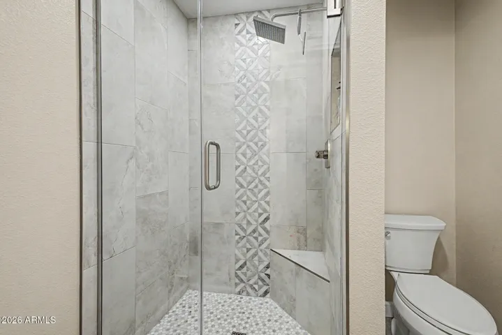 walk in shower with custom tile surround