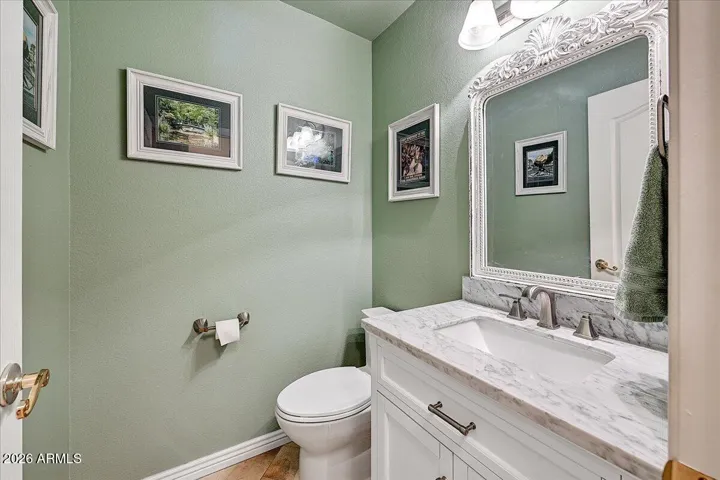 Double sinks in guest bath with upgraded fixtures and sink warmly welcomes your family and guests.