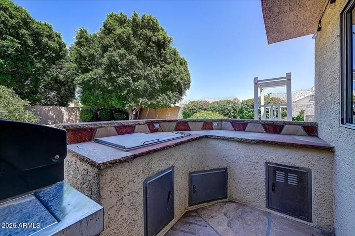 This outdoor kitchen space has room for everything you need for entertaining outside