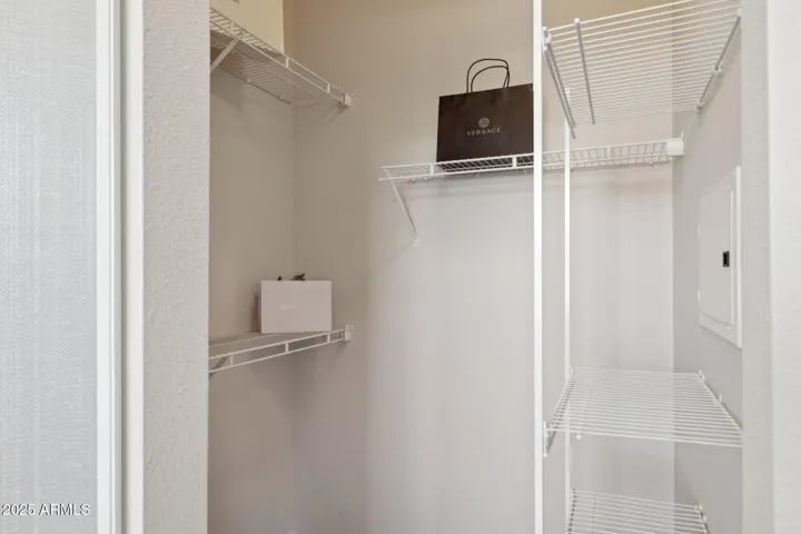Walk-in closet with mirrored door