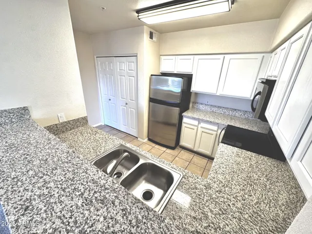 Laundry closet, new ceiling light, granite counters, and painted cabinets!