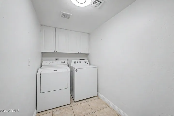 Inside laundry with plenty of storage