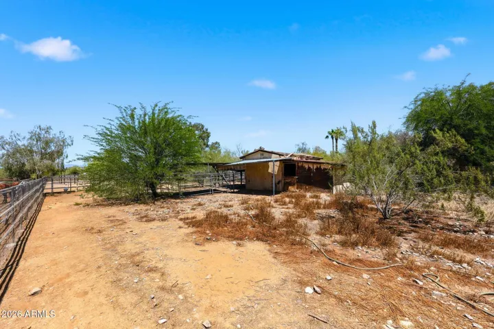 POTENTIAL!! Back section of the lot behind the stables.