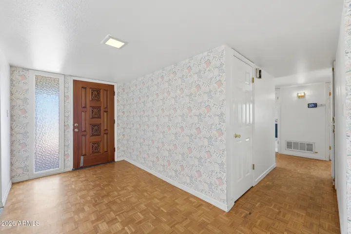 Entry hall, leading to the bedroom wing of the home.