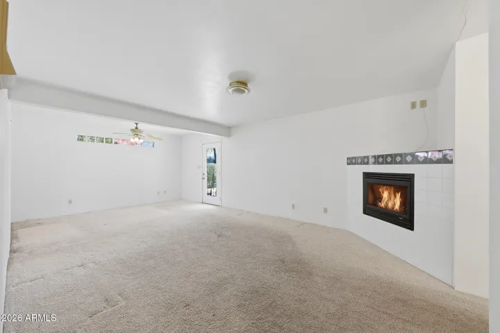 Large primary suite with an electric fireplace.