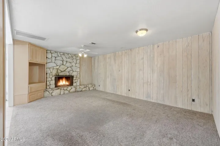 Family Room with a wood burning fire place.