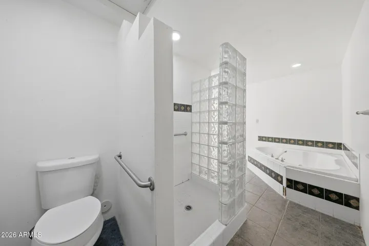 Primary Suite Bath with a separate tub and shower.