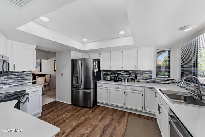 Wonderful, Large Kitchen with Stainless appliances, Quartz Countertops, raised ceiling.