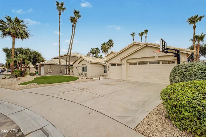 Generous driveway with room to park or play hoops!