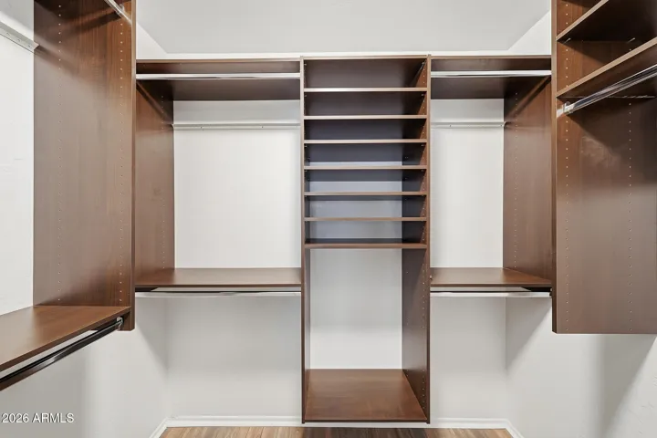 Custom closet system with built-in shelving for easy organization