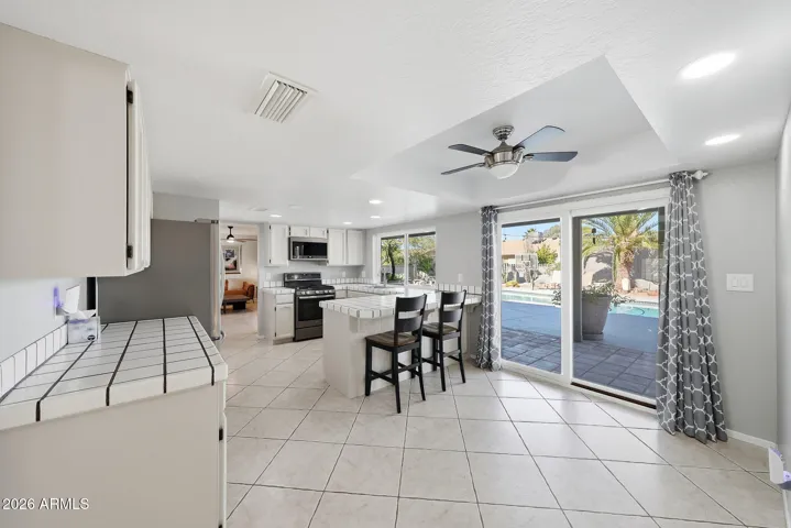 All cabinets refinished with updated stainless steel appliance package, including a 4-burner gas stove with griddle