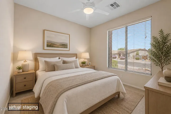 The secondary bedroom is separated from the primary bedroom. (It’s virtually staged.)