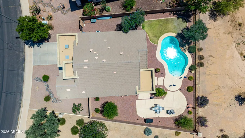 A drone view showcases the premium corner lot, highlighting its expansive size.