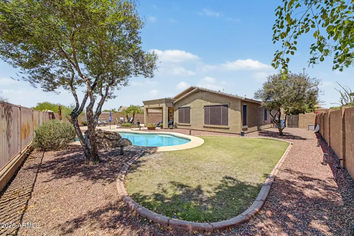 Grass with outside curb creates a refreshing space for the family to relax and animals to roam freely.