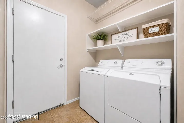 Laundry with ample shelving for extra storage, perfect for those Costco trips.