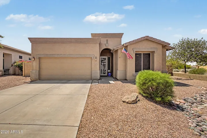 A low-maintenance front yard with a custom-designed security door.