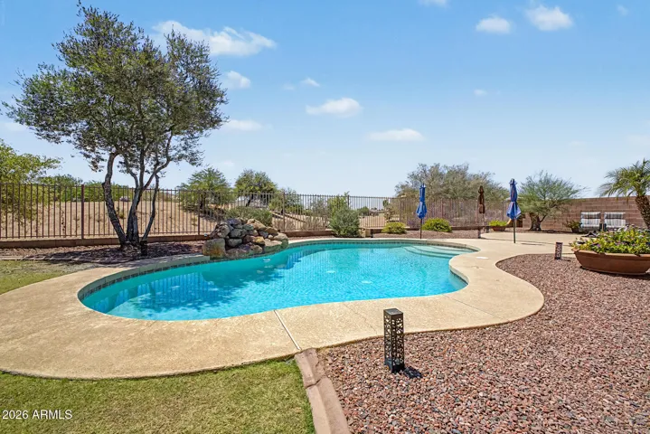 A sparkling pool with a water feature.