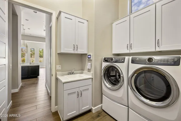 Equipped with a sink and ample cabinet space