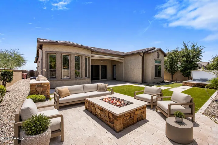 Easy-to-maintain turf, gas fire pit patio, spa, and built-in BBQ!