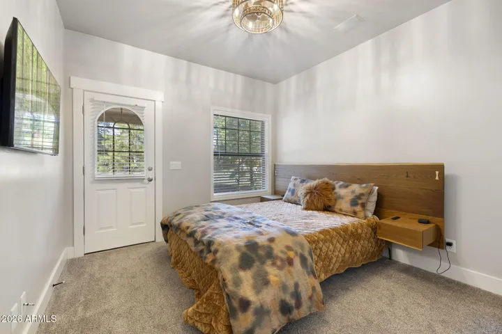 Ensuite bedroom located on main floor with its own door to outside.