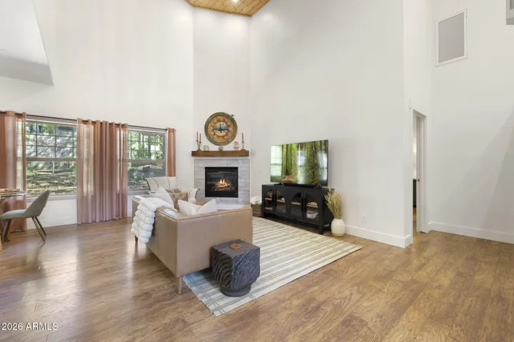 Open, bright and cozy living area with fireplace.