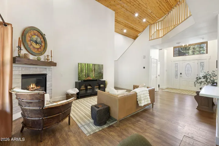 Comfortable great room with high decorative wood ceilings.