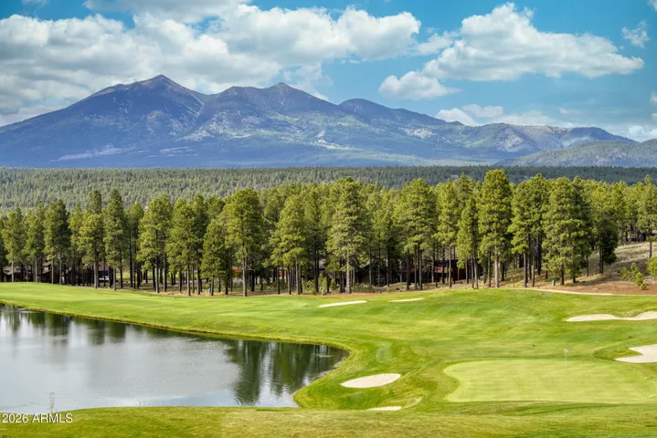 Beautiful hole 18 with fully stocked lake for fishing.
