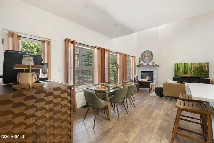 Dining with a view and open to the great room with fireplace.