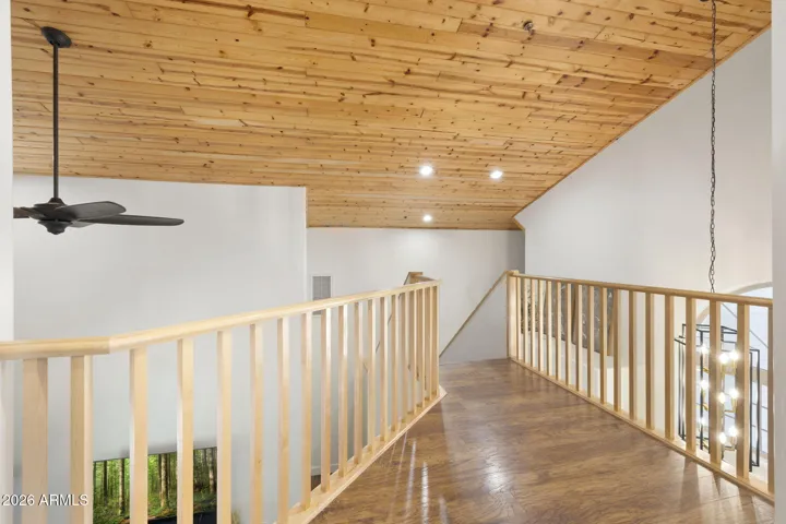 Open loft bridge overlooking the great room & front entry.