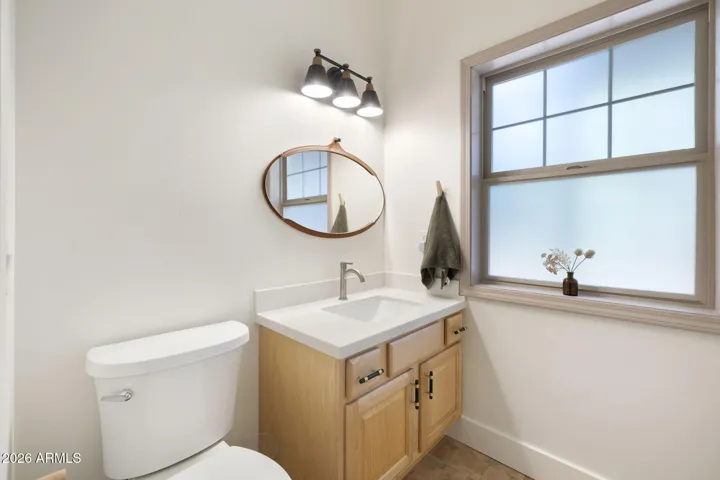 Updated Powder room located on main floor by the kitchen area.