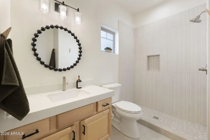 Ensuite bathroom recently remodeled with new shower, toilet, cabinet and countertop.
