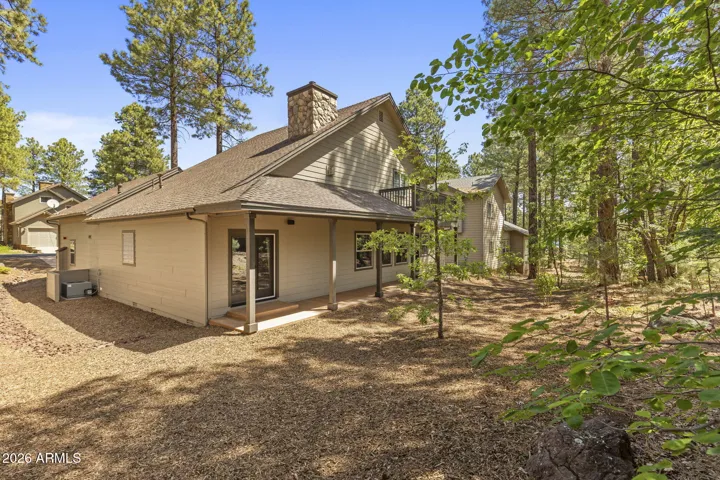 Clean & refreshed yard for relaxing in the pines.