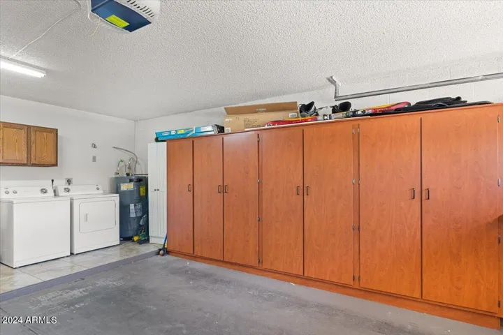 Oversized two-car garage with built-in storage cabinets and laundry area
