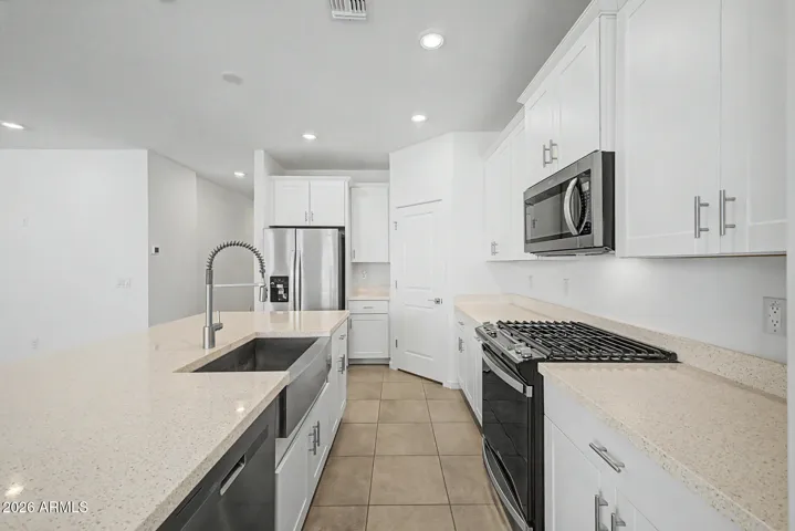 Quartz Counters, Stainless Appliances