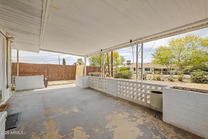 This spacious covered patio extends the living space outdoors, offering a shaded spot to relax, enjoy your morning coffee, or visit with friends. With plenty of room for seating and easy-care surroundings, it’s a comfortable space to enjoy the Arizona lifestyle.