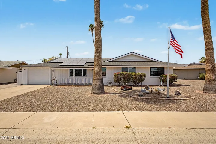 Charming Sun City home with inviting curb appeal, a low-maintenance desert landscape, and a welcoming covered front patio perfect for enjoying Arizona mornings.
