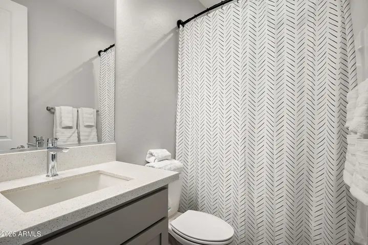 Delta fixtures and quartz countertops.