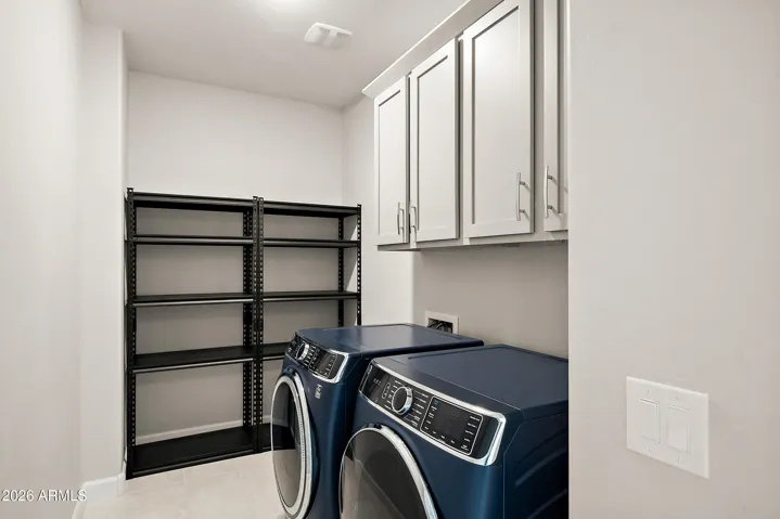 Upgraded washer and dryer, extra storage shelving & custom cabinetry.