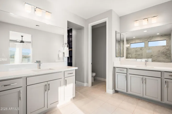 Super spa shower in primary suite, split vanities, quartz countertops and separate water closet.