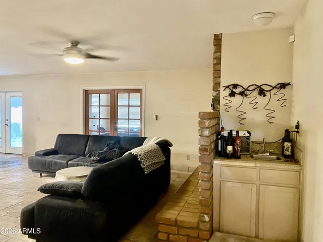 greatroom with fireplace and wet bar