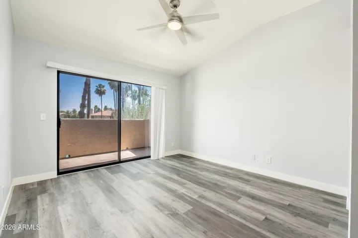 Primary bedroom with balcony