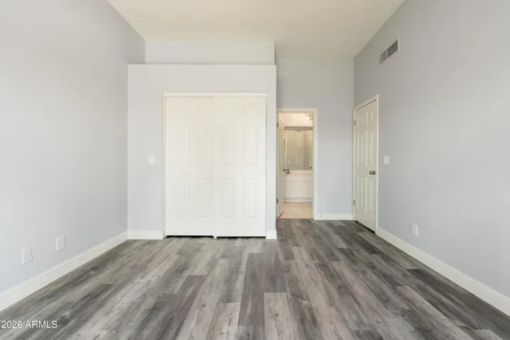 Primary bedroom with walk-in closet